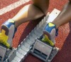 Athletic Feet of Runner Positioned at Starting Block